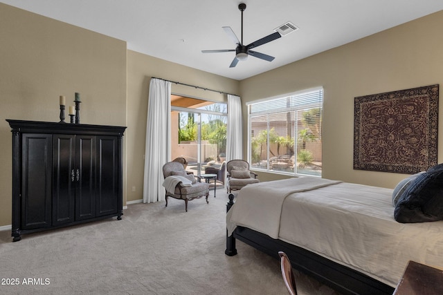 bedroom with light colored carpet, a ceiling fan, visible vents, and baseboards