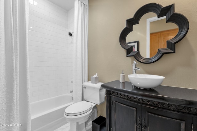 bathroom with vanity, shower / bath combo with shower curtain, and toilet