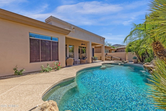 view of swimming pool featuring a fenced in pool, a patio, ceiling fan, and a fenced backyard