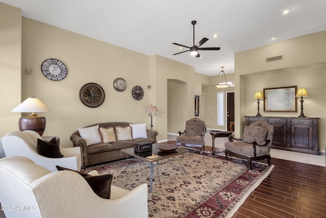 living area with visible vents, wood finished floors, baseboards, recessed lighting, and a ceiling fan