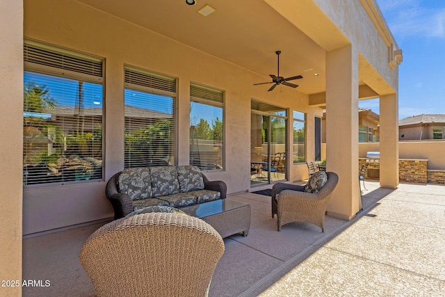 view of patio / terrace featuring an outdoor kitchen, ceiling fan, and an outdoor living space
