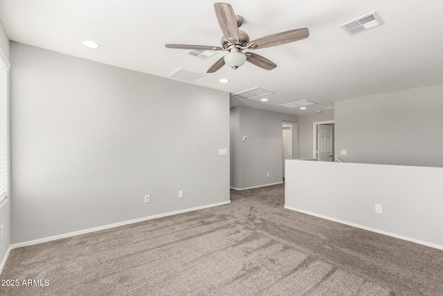 spare room with ceiling fan and carpet flooring