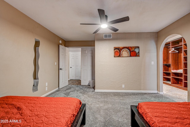 6520 E Peak View Rd, Cave Creek, AZ 85331 - carpeted bedroom featuring arched walkways, baseboards, and ceiling fan