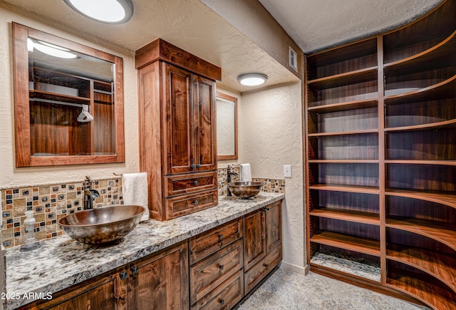 6520 E Peak View Rd, Cave Creek, AZ 85331 - full bath with a textured wall, double vanity, baseboards, and a textured ceiling