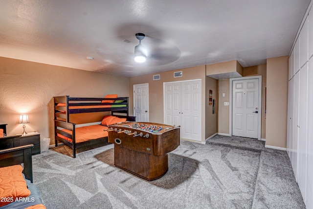 6520 E Peak View Rd, Cave Creek, AZ 85331 - carpeted bedroom featuring two closets, baseboards, and ceiling fan