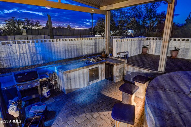 6520 E Peak View Rd, Cave Creek, AZ 85331 - view of patio featuring a fenced backyard, exterior kitchen, a swimming pool, and a bar
