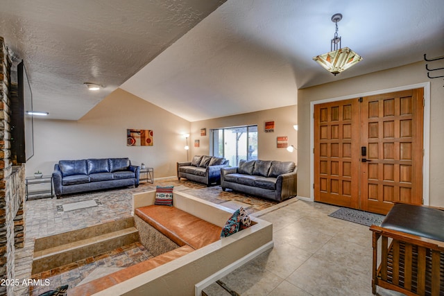 6520 E Peak View Rd, Cave Creek, AZ 85331 - living area featuring lofted ceiling, a textured ceiling, and tile patterned floors