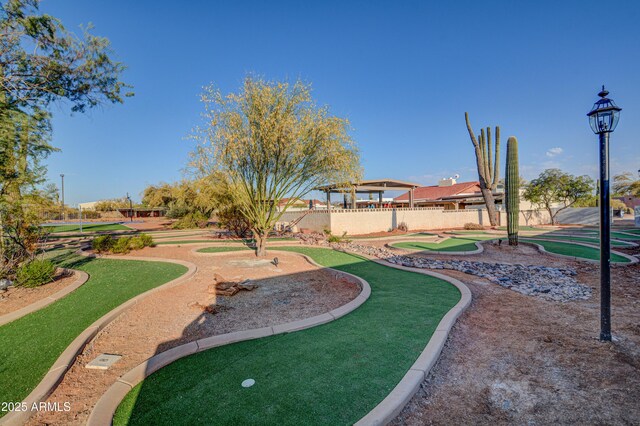 6520 E Peak View Rd, Cave Creek, AZ 85331 - view of property's community with an area to practice putting and fence
