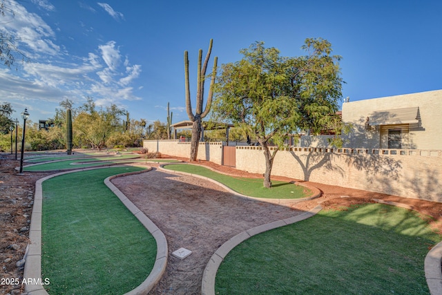 6520 E Peak View Rd, Cave Creek, AZ 85331 - view of yard with a putting green and fence