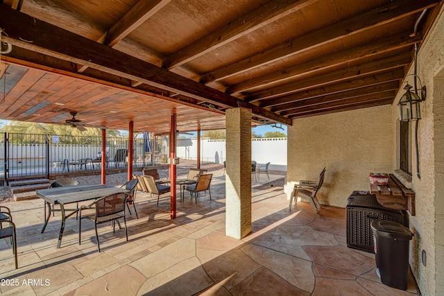 6520 E Peak View Rd, Cave Creek, AZ 85331 - view of patio / terrace with a fenced backyard, outdoor dining area, a ceiling fan, and a water view