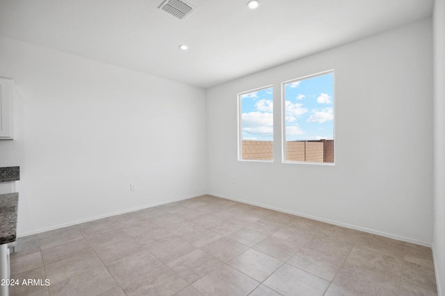 spare room with light tile patterned floors