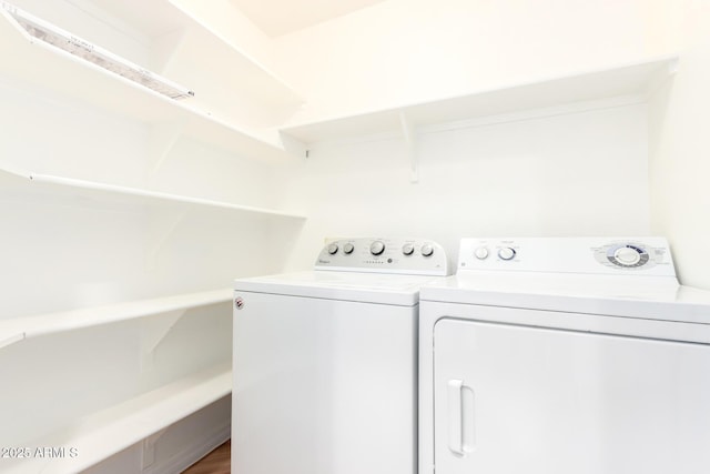 clothes washing area with laundry area and washing machine and clothes dryer