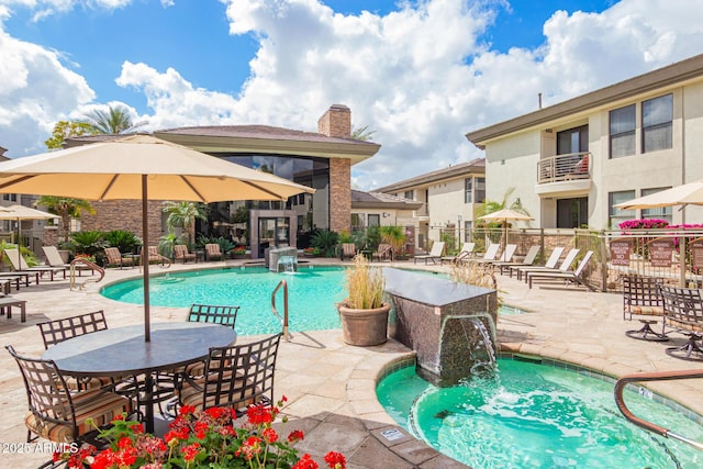 pool featuring a patio area and fence