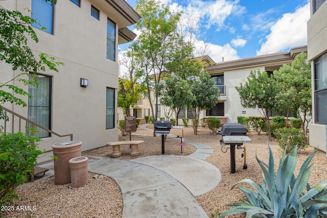 surrounding community featuring a patio