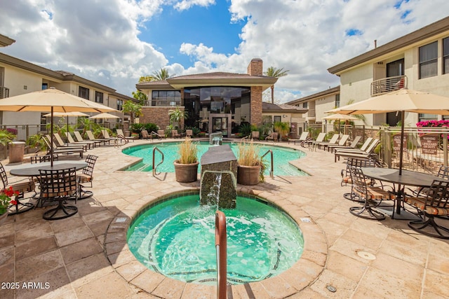 pool featuring a patio and fence