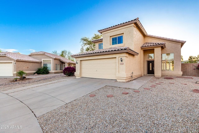 8450 S Stephanie Ln, Tempe, AZ 85284 - mediterranean / spanish house featuring stucco siding, concrete driveway, and a tile roof