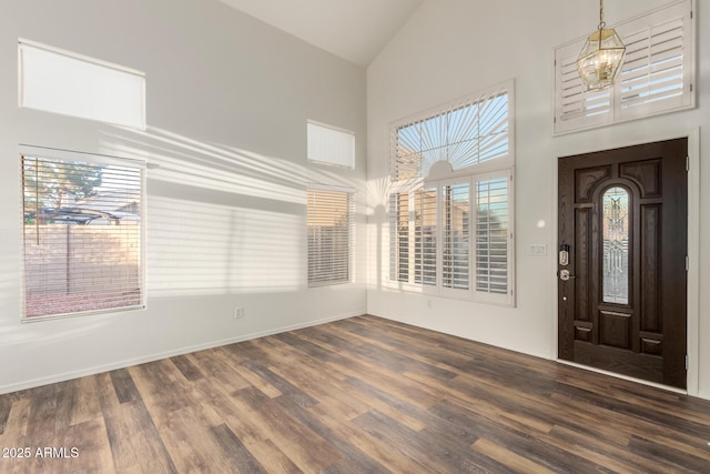 8450 S Stephanie Ln, Tempe, AZ 85284 - foyer entrance with high vaulted ceiling, wood finished floors, a chandelier, and baseboards