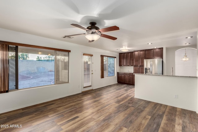 8450 S Stephanie Ln, Tempe, AZ 85284 - kitchen featuring stainless steel refrigerator with ice dispenser, dark brown cabinetry, ceiling fan, dark wood-style flooring, and baseboards