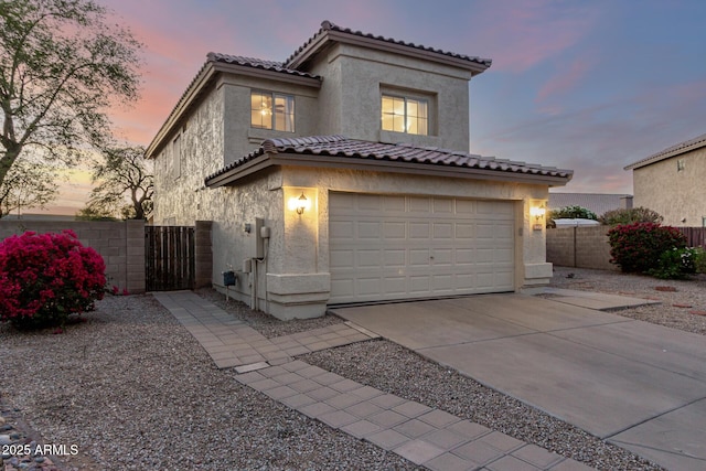 8450 S Stephanie Ln, Tempe, AZ 85284 - mediterranean / spanish home with stucco siding, driveway, and a gate