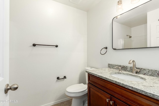 8450 S Stephanie Ln, Tempe, AZ 85284 - bathroom featuring vanity, toilet, and baseboards