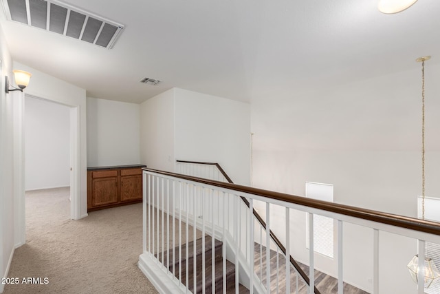 8450 S Stephanie Ln, Tempe, AZ 85284 - hallway featuring an upstairs landing and light colored carpet