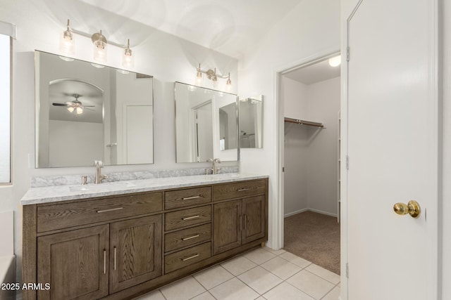 8450 S Stephanie Ln, Tempe, AZ 85284 - bathroom with double vanity, tile patterned floors, ceiling fan, and a spacious closet