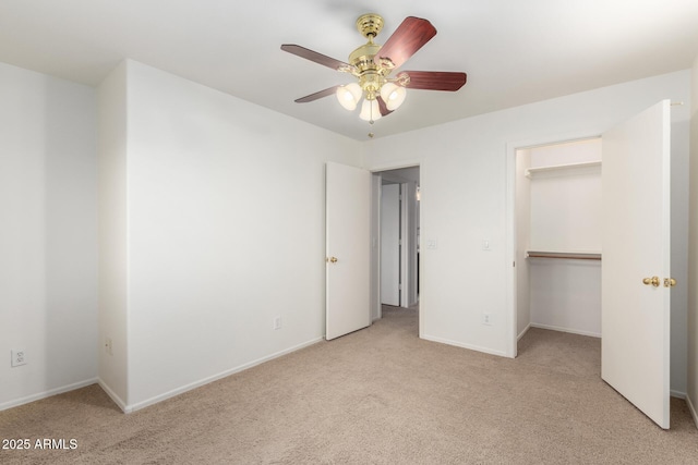8450 S Stephanie Ln, Tempe, AZ 85284 - unfurnished bedroom featuring light carpet, a walk in closet, baseboards, a ceiling fan, and a closet