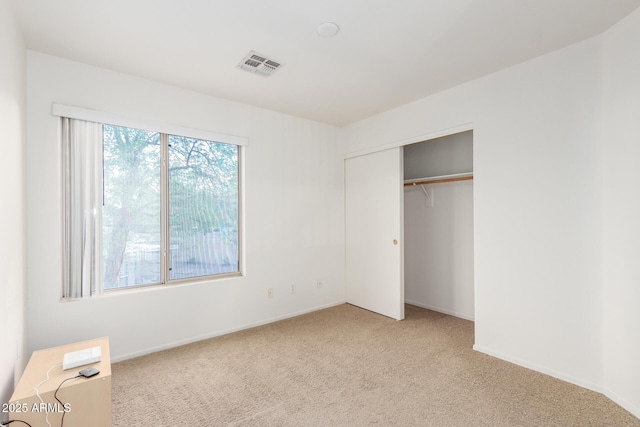 8450 S Stephanie Ln, Tempe, AZ 85284 - unfurnished bedroom with light carpet, baseboards, and a closet