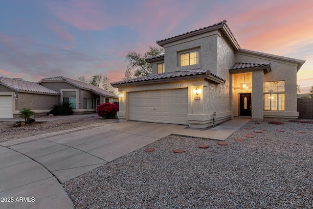 8450 S Stephanie Ln, Tempe, AZ 85284 - mediterranean / spanish house featuring driveway, stucco siding, and a tiled roof