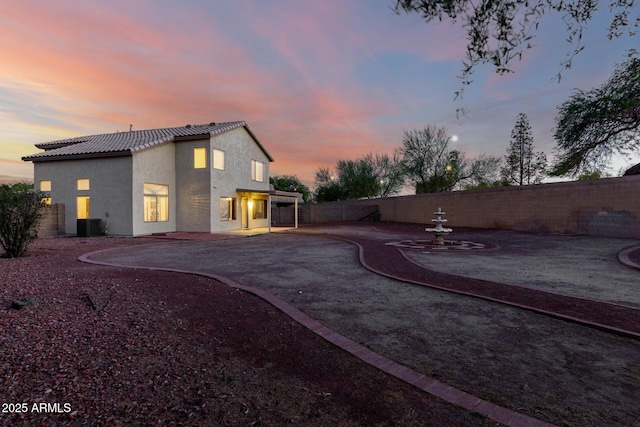 8450 S Stephanie Ln, Tempe, AZ 85284 - rear view of property featuring a patio, a tiled roof, a fenced backyard, and stucco siding