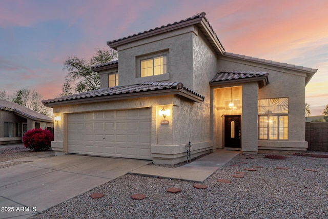8450 S Stephanie Ln, Tempe, AZ 85284 - mediterranean / spanish-style home with stucco siding, a tile roof, and driveway