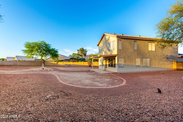 8450 S Stephanie Ln, Tempe, AZ 85284 - back of house featuring a patio area, stucco siding, and a tile roof