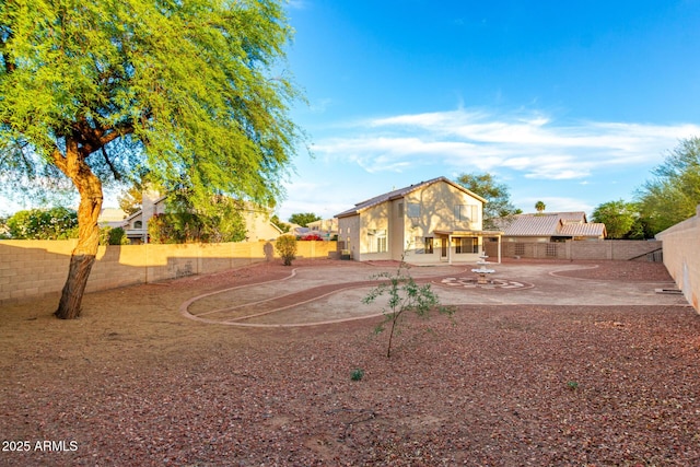 8450 S Stephanie Ln, Tempe, AZ 85284 - back of house featuring a fenced backyard, a patio area, and stucco siding