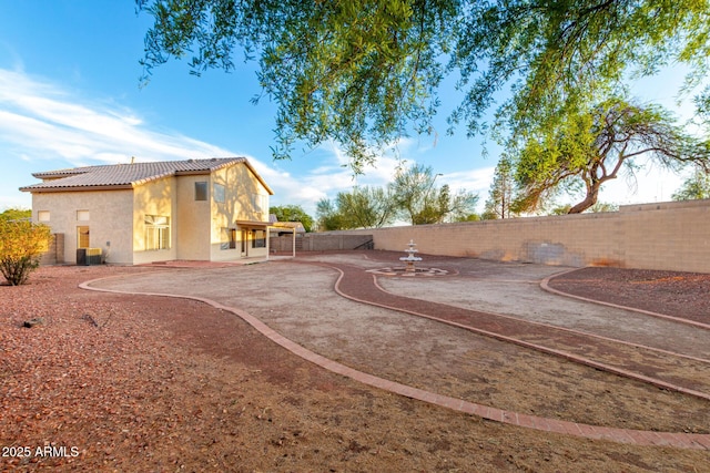 8450 S Stephanie Ln, Tempe, AZ 85284 - fenced backyard featuring a patio area