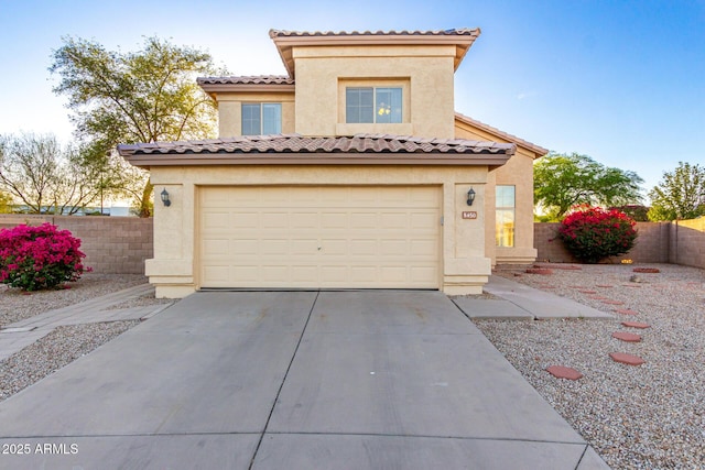 8450 S Stephanie Ln, Tempe, AZ 85284 - mediterranean / spanish-style house with concrete driveway, an attached garage, and stucco siding