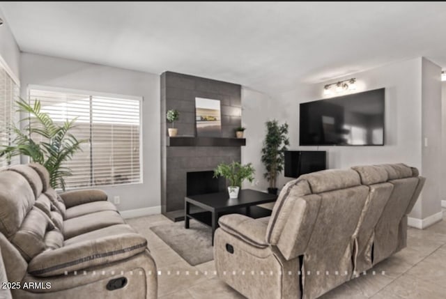 1914 S Brooks Cir, Mesa, AZ 85202 - living area featuring a large fireplace, baseboards, and light tile patterned floors