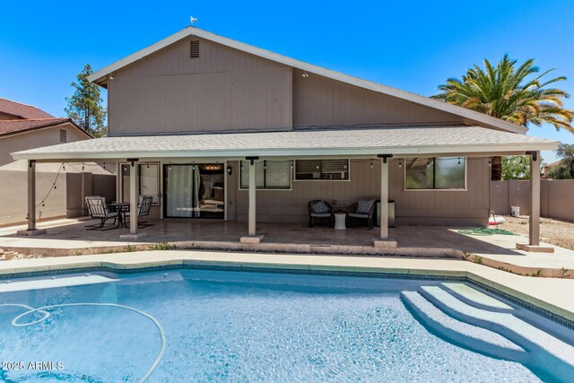1914 S Brooks Cir, Mesa, AZ 85202 - back of house with a shingled roof, a patio area, an outdoor pool, and an outdoor hangout area