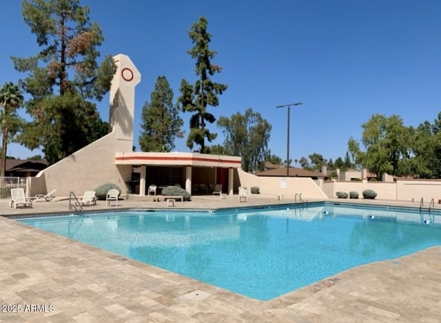1914 S Brooks Cir, Mesa, AZ 85202 - community pool featuring a patio