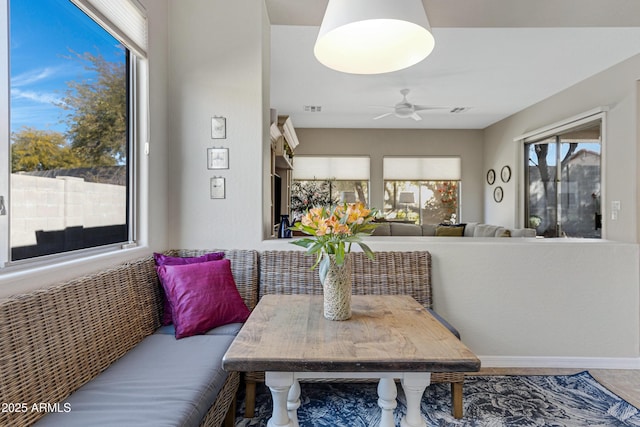 dining room featuring breakfast area and ceiling fan