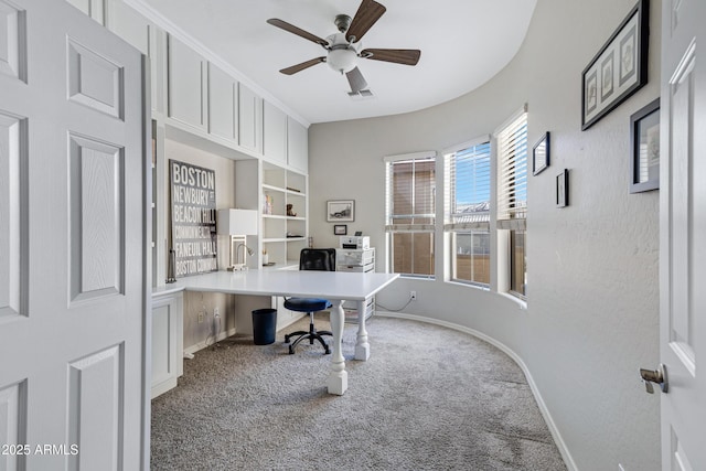 office with carpet floors and ceiling fan