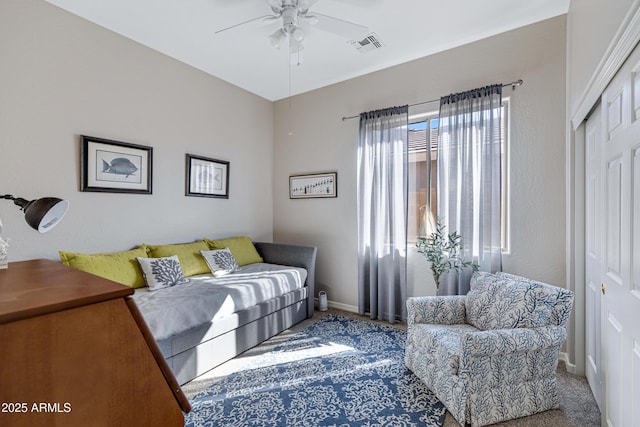 interior space featuring carpet floors, a closet, and ceiling fan