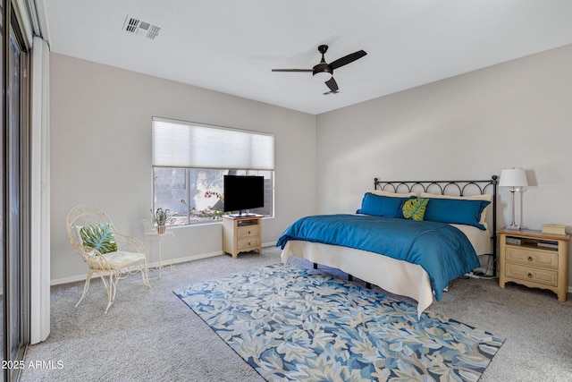 bedroom featuring ceiling fan and light carpet