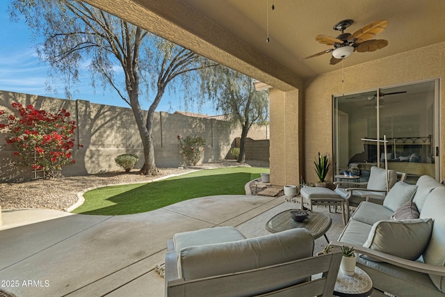 view of patio / terrace with an outdoor living space and ceiling fan