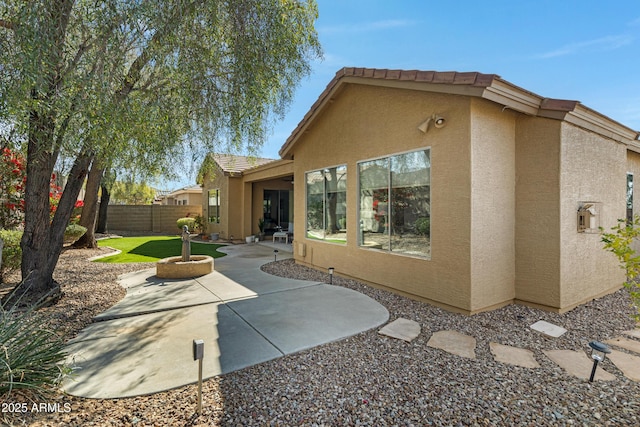 rear view of house featuring a patio