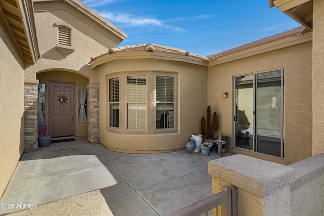 entrance to property with a patio area