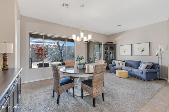 dining room with a notable chandelier