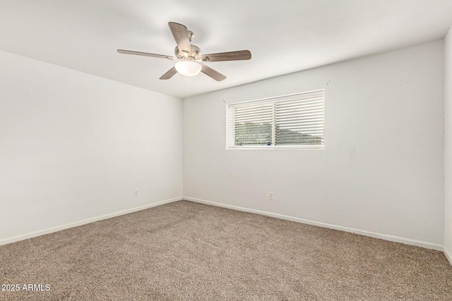 spare room with ceiling fan and carpet flooring