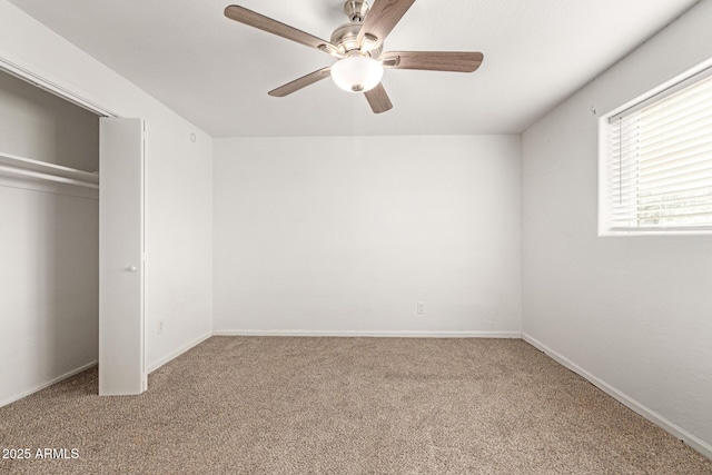 unfurnished bedroom with carpet floors, ceiling fan, and a closet