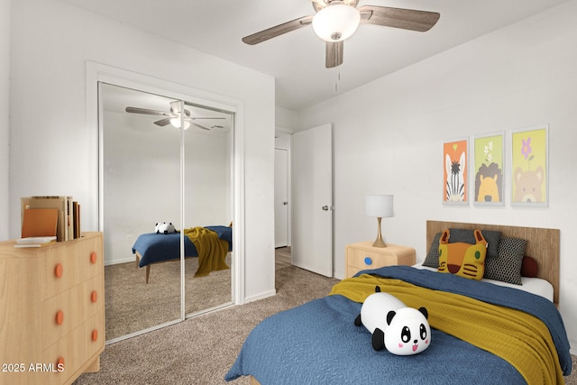 carpeted bedroom featuring a closet and ceiling fan