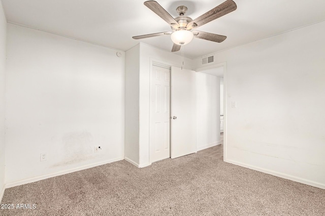 unfurnished bedroom with a closet, ceiling fan, and carpet flooring